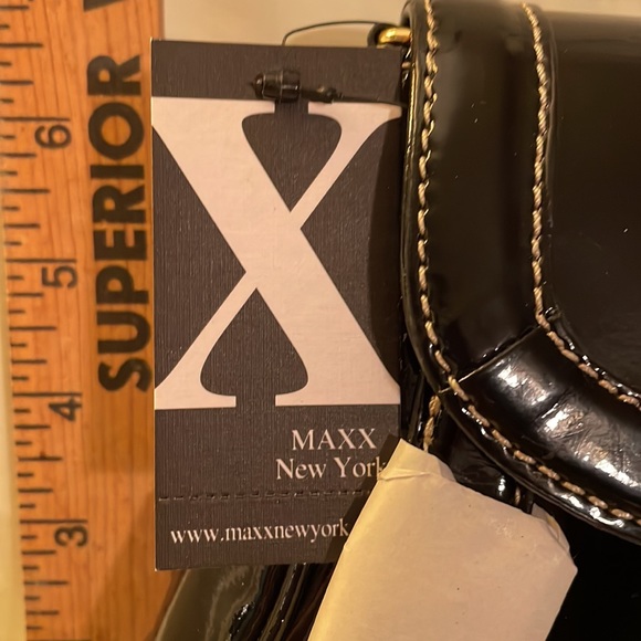 Black brand new MAXX NEW YORK purse. Never used no rips, tears or damage. 14 x 7 - Picture 3 of 11